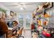 Bright home office with lots of storage space, featuring French doors and vinyl plank flooring at 7912 3Rd S Ave, St Petersburg, FL 33707
