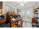 Bright home office featuring French doors and vinyl plank flooring at 7912 3Rd S Ave, St Petersburg, FL 33707