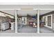Covered patio with ceiling fans, stone wall, and full bar perfect for entertaining at 7912 3Rd S Ave, St Petersburg, FL 33707