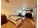 Bright bedroom with hardwood floors and two beds, illuminated by natural light from the window at 804 Valley Hill Ct, Brandon, FL 33510