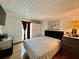 Bright bedroom with hardwood floors, a double bed, and neutral walls at 804 Valley Hill Ct, Brandon, FL 33510