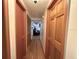 Hallway with hardwood floors featuring access to bedrooms and living room at 804 Valley Hill Ct, Brandon, FL 33510