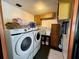 Laundry room equipped with a washer and dryer and storage cabinets at 804 Valley Hill Ct, Brandon, FL 33510