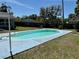 Backyard swimming pool surrounded by a grass and a fenced yard at 804 Valley Hill Ct, Brandon, FL 33510