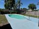 Backyard swimming pool surrounded by a concrete deck and grass at 804 Valley Hill Ct, Brandon, FL 33510