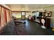 Cozy sunroom with multiple access points, a loveseat, and a TV at 804 Valley Hill Ct, Brandon, FL 33510