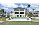 Waterfront residence boasts an inviting pool and offers breathtaking views, creating a perfect retreat at 882 Bay Point Dr, Madeira Beach, FL 33708