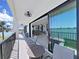 Relaxing balcony with waterfront views and comfortable seating perfect for enjoying the outdoors at 882 Bay Point Dr, Madeira Beach, FL 33708