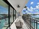 Beautiful balcony with outdoor seating, overlooks pool, and offers views of waterway at 882 Bay Point Dr, Madeira Beach, FL 33708