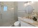 Bathroom featuring a glass enclosed shower, vanity, and toilet at 882 Bay Point Dr, Madeira Beach, FL 33708