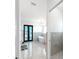 Luxurious bathroom featuring a soaking tub, glass shower, and modern fixtures at 882 Bay Point Dr, Madeira Beach, FL 33708