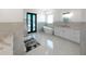 Luxurious bathroom featuring a soaking tub, glass shower, and modern fixtures at 882 Bay Point Dr, Madeira Beach, FL 33708