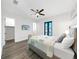 Bedroom with a ceiling fan, tv, balcony access, and ensuite bathroom at 882 Bay Point Dr, Madeira Beach, FL 33708