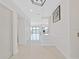 Bright foyer leads to a living space with water views and stairs leading up to the next level at 882 Bay Point Dr, Madeira Beach, FL 33708