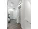 Hallway featuring wood floors and white walls with doors and an elevator at 882 Bay Point Dr, Madeira Beach, FL 33708