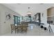 Stylish living and dining space with modern furnishings, ample natural light, and sleek design at 882 Bay Point Dr, Madeira Beach, FL 33708