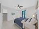 Spacious main bedroom with white walls and access to a balcony at 882 Bay Point Dr, Madeira Beach, FL 33708