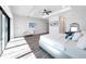 Spacious main bedroom features tray ceiling and hardwood floors at 882 Bay Point Dr, Madeira Beach, FL 33708