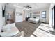 Bright main bedroom features tray ceiling, water view, and plenty of natural light at 882 Bay Point Dr, Madeira Beach, FL 33708