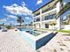 Gorgeous waterfront home with a refreshing pool, lush turf, and expansive balconies at 882 Bay Point Dr, Madeira Beach, FL 33708