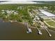 Breathtaking aerial view of a waterfront community with docks, lush greenery, and a serene coastal setting at 8820 S Hickory Ln, Riverview, FL 33578