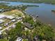 Scenic aerial view of a waterfront neighborhood featuring cozy homes, private docks, and peaceful waterways at 8820 S Hickory Ln, Riverview, FL 33578