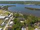 Picturesque aerial view of waterfront homes with boat docks, surrounded by tranquil waters and beautiful natural scenery at 8820 S Hickory Ln, Riverview, FL 33578