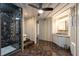 Bathroom with tiled shower, single vanity and view to toilet at 8820 S Hickory Ln, Riverview, FL 33578