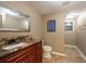 Bathroom featuring granite countertop, modern vanity, and neutral tile flooring at 8820 S Hickory Ln, Riverview, FL 33578