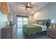 Bedroom with bed, nightstands, dresser, and sliding glass door to patio at 8820 S Hickory Ln, Riverview, FL 33578