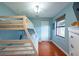 Bright bedroom with bunk beds, hardwood floors, and plenty of natural light at 8820 S Hickory Ln, Riverview, FL 33578