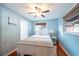 Comfortable bedroom with natural light, ceiling fan, and cozy decor at 8820 S Hickory Ln, Riverview, FL 33578