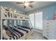 Blue-toned bedroom with bunk beds, closet and tile floors at 8820 S Hickory Ln, Riverview, FL 33578