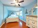 Serene bedroom featuring hardwood floors, a comfortable bed, and classic furniture at 8820 S Hickory Ln, Riverview, FL 33578