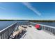 Waterfront deck with lounge chairs and scenic views, ideal for relaxing and enjoying the outdoors at 8820 S Hickory Ln, Riverview, FL 33578