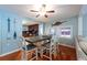 Charming dining room with nautical decor, wood floors, and a view into the kitchen at 8820 S Hickory Ln, Riverview, FL 33578