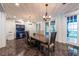 Open dining room features a large table, blue hutch, and plenty of natural light at 8820 S Hickory Ln, Riverview, FL 33578