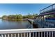 Dock stretching over the water, connecting to a covered boat lift and second story observation deck at 8820 S Hickory Ln, Riverview, FL 33578