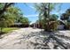 Exterior of home and garage with circular driveway and well-maintained landscaping at 8820 S Hickory Ln, Riverview, FL 33578