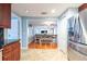 Modern kitchen featuring stainless steel appliances and an open floor plan to the dining room at 8820 S Hickory Ln, Riverview, FL 33578