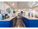 Spacious kitchen features stainless steel appliances, granite countertops and large island at 8820 S Hickory Ln, Riverview, FL 33578