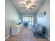 Cozy living room with a sliding glass door, tile floors and gray futon at 8820 S Hickory Ln, Riverview, FL 33578