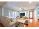 Comfortable living room with tile flooring and a large window with sliding doors for natural light at 8820 S Hickory Ln, Riverview, FL 33578