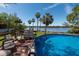 Backyard pool and deck with lounge chairs, perfect for soaking up the sun and enjoying the views at 8820 S Hickory Ln, Riverview, FL 33578