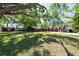 Estate grounds feature a sprawling lawn with shade trees and a grand home at 8820 S Hickory Ln, Riverview, FL 33578