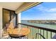 Balcony seating with expansive water views creating a relaxing outdoor space to enjoy the scenery at 9415 Blind Pass Rd # 704, St Pete Beach, FL 33706