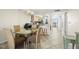 Open-concept floor plan with sightlines from the dining room into the updated kitchen at 9415 Blind Pass Rd # 704, St Pete Beach, FL 33706