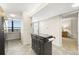 Modern kitchen boasts sleek cabinetry, contemporary appliances, and a convenient island, next to a serene bedroom at 9415 Blind Pass Rd # 704, St Pete Beach, FL 33706