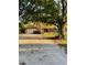 Charming single-story home with a large front yard and attached two-car garage offering a cozy and inviting curb appeal at 7006 41St E Ave, Bradenton, FL 34208