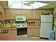 Functional kitchen featuring ample cabinetry, modern appliances, and a unique skylight providing plenty of natural light at 7006 41St E Ave, Bradenton, FL 34208
